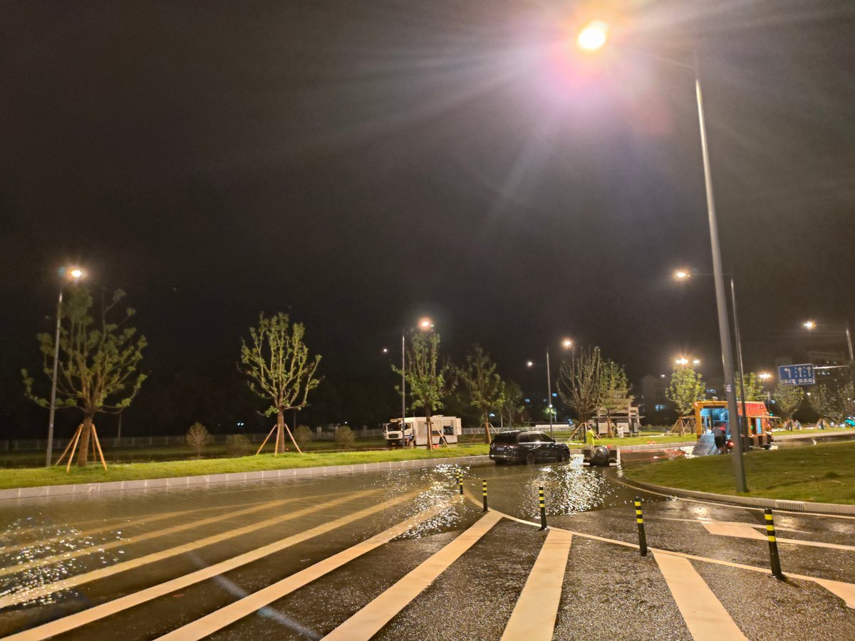 AnNasMiley97's tweet photo. [Rain-slicked city street after downpour — neon lights bleeding into puddles, a stranger’s bike propped against a brick wall. Small, quiet magic in the chaos. ]， https://t.co/Rp5UGmF4oz