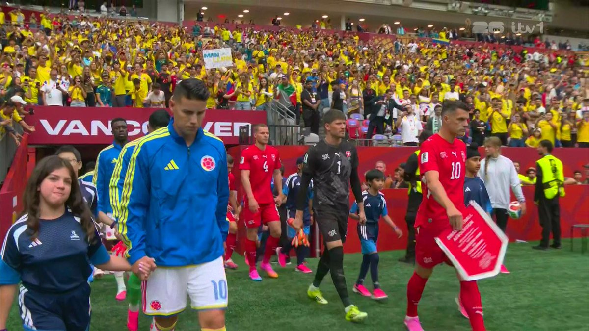 Sporting_Matrix's tweet photo. James and Xhaka lead out their teams in the final Round of 16 clash!

🇨🇭🇨🇴 https://t.co/WpOpZr6zVd