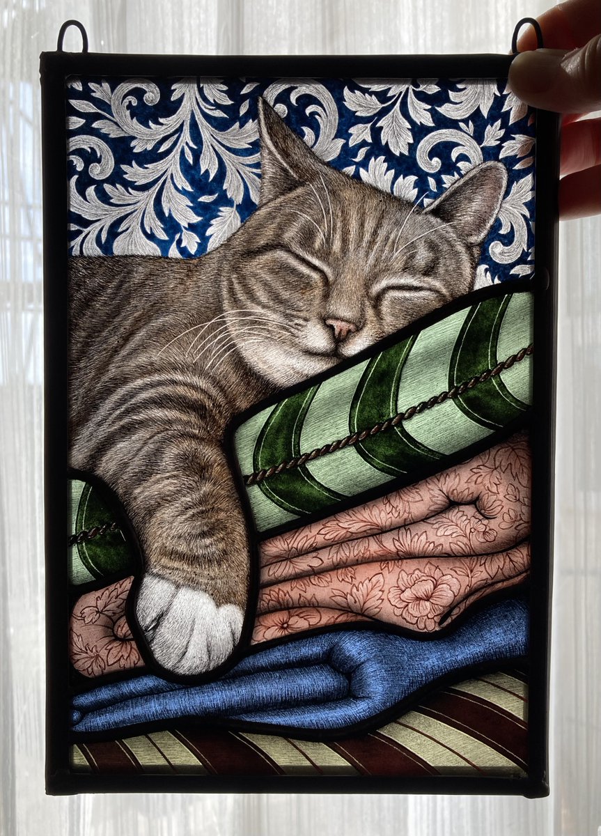 LornaSharkey1's tweet photo. A new stained glass panel hand painted with a sleeping cat (in its rightful place!) on a cushion & blankets with a decorative background 😸🤗
#glassart #stainedglass #decorativeart #happycat https://t.co/RpicA7ftvf