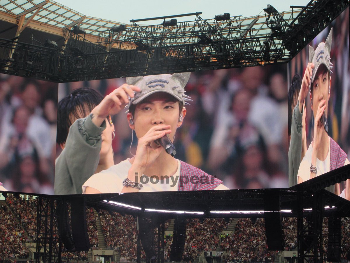 joonypear's tweet photo. jungkook being curious about namjoon’s kitty hat… my babies (head in hands) https://t.co/u85JFnjtmj