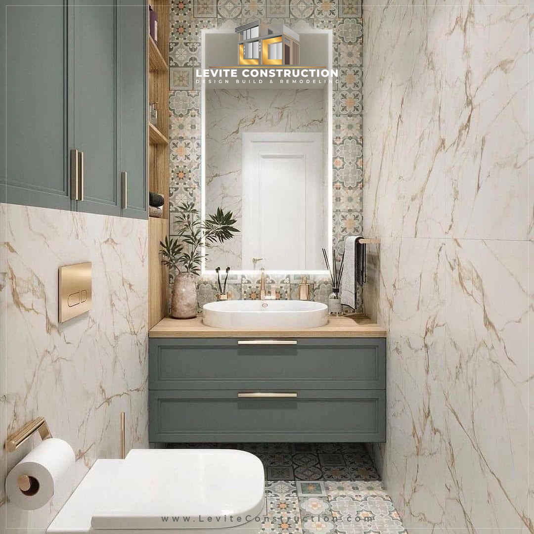 LeviteConstruc1's tweet photo. Small footprint, maximum luxury. 💎 We packed this narrow powder room transformation with premium features: a custom floating vanity in sage green, brushed gold accents, an LED backlit mirror, and seamless marble look panels. Ready to upgrade your space? Let’s chat! 🛠️#Bathroom https://t.co/Of8NVZ7lUV