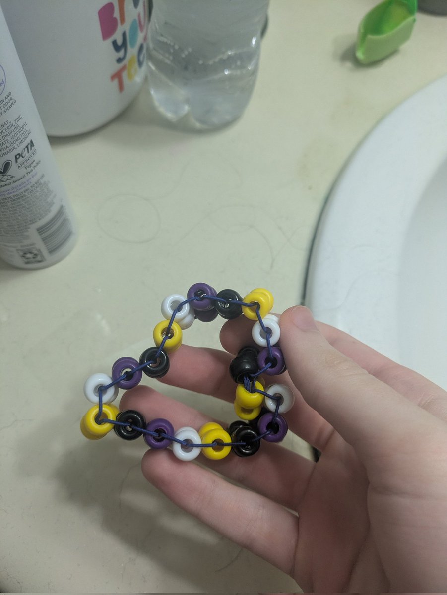 liminellepee's tweet photo. why did my sister make a nonbinary bracelet https://t.co/QawkN8rUnT