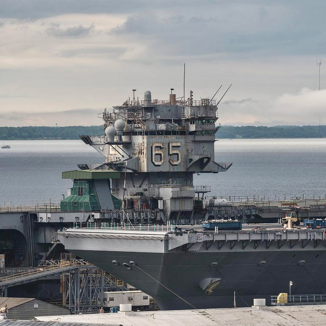 Boneyardsafari's tweet photo. USS Enterprise CVN-65 in 2019 being inactivated at Newport News in 2019. Unlike later carriers (which use two), the Enterprise was built with eight A2W nuclear reactors originally designed for submarines. This made refueling and maintaining the obsolete technology incredibly https://t.co/3dpvHZawwl