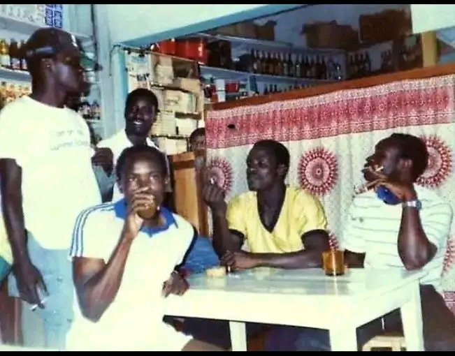 nyorude's tweet photo. Gor Mahia players-Ben Oloo "Breakdance", Peter Otieno "Basanga", Sammy Onyango "Jogoo" and George Otieno "Solo", were captured in an unguarded moment, unwinding at a local pub in Antananarivo, during a break from football engagements when they toured Madagascar  in 1988. https://t.co/JQ19uxaK8d