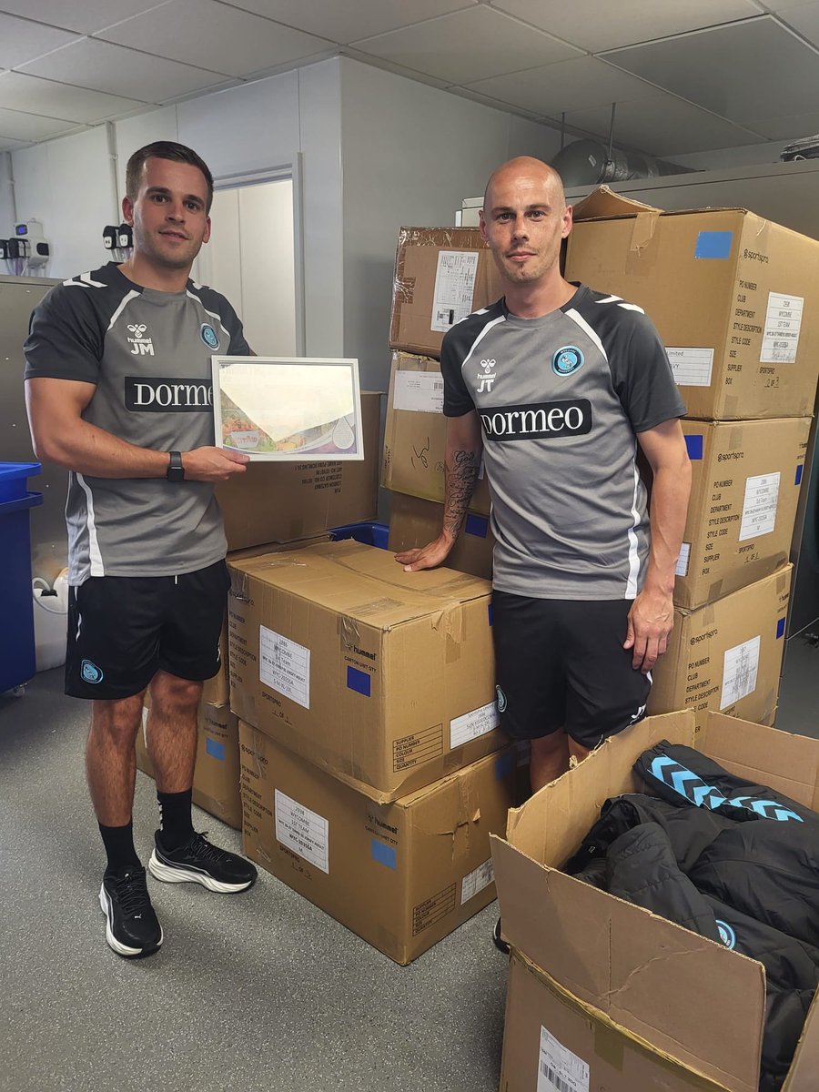 KitAid's tweet photo. A huge thank you to Jordan &amp; JT from @wwfcofficial for their fantastic kit donation! ⚽💙

Soon, Chairboys fans across Africa will be wearing it with pride.

Best of luck to everyone at Wycombe Wanderers for the new season!

#KitAid #Chairboys #WycombeWanderers https://t.co/TF6E05NrLr