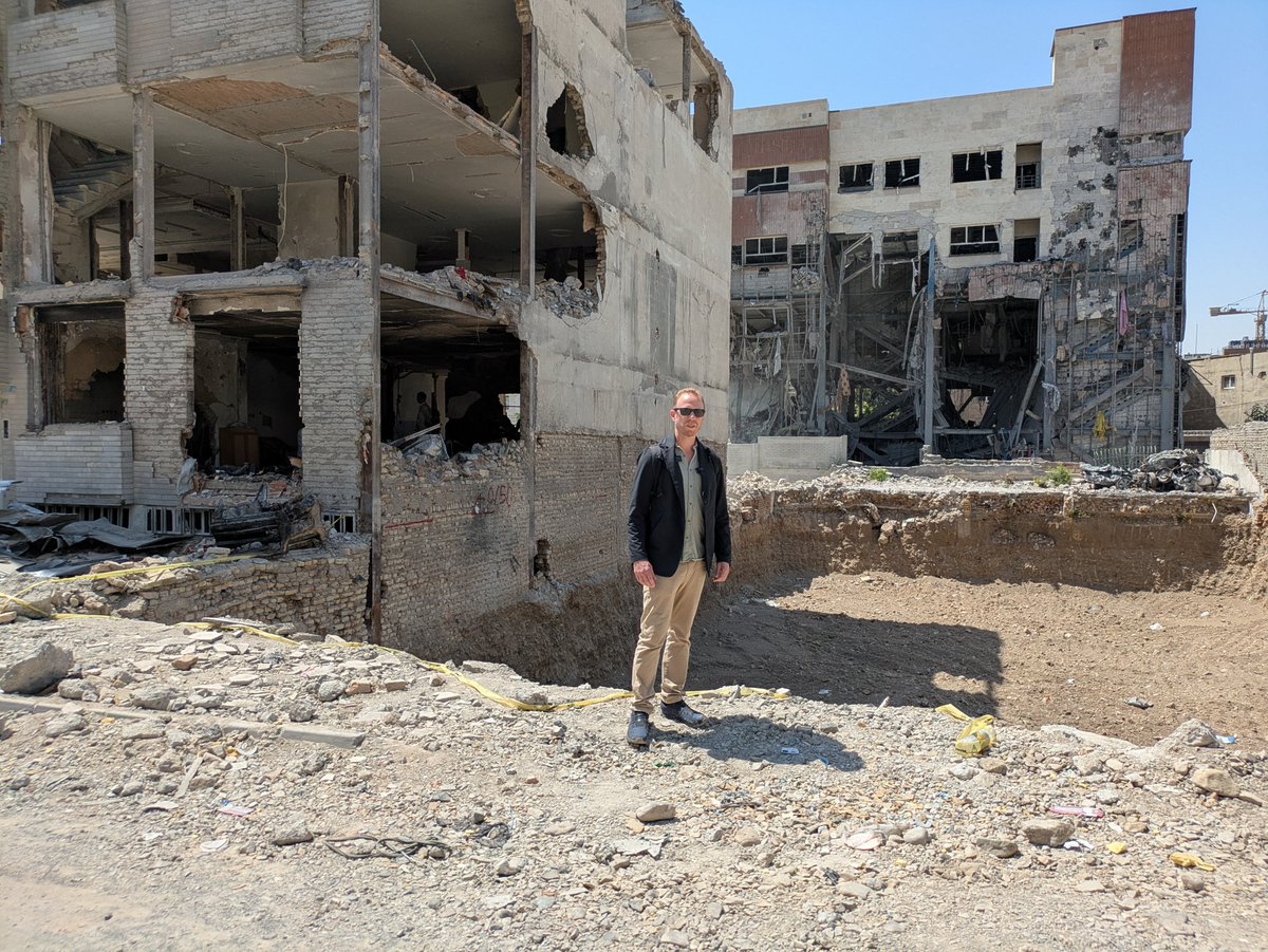 MaxBlumenthal's tweet photo. At the site of an American strike in a densely populated residential neighborhood in eastern Tehran on 3/9

40 were killed here with 8 missiles, including a family of 12

I found children's clothes in the rubble

Some 40-50,000 residential units were damaged in Tehran alone https://t.co/ojt7aOVUec