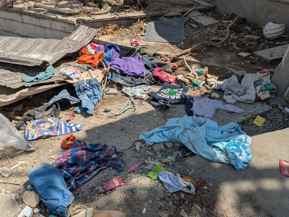 MaxBlumenthal's tweet photo. At the site of an American strike in a densely populated residential neighborhood in eastern Tehran on 3/9

40 were killed here with 8 missiles, including a family of 12

I found children's clothes in the rubble

Some 40-50,000 residential units were damaged in Tehran alone https://t.co/ojt7aOVUec