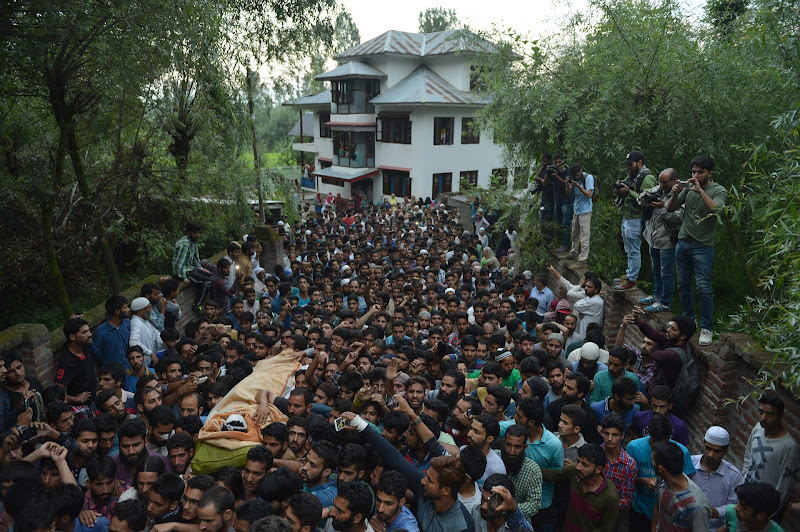 thecaravanindia's tweet photo. Mourners carry the body of the 21-year-old Hizbul Mujahideen militant Burhan Wani in his hometown, Tral. On this day, in 2016, Indian security forces killed Wani in Kashmir’s Anantnag district. Wani’s killing triggered the fiercest protests Kashmir has seen since 2010.

Burhan Wani “openly challenged the mighty Indian state,” a Kashmiri journalist said. “No more hiding guns under the pheran. No more using pseudonyms. No more hiding behind a mask.” That year, several people, including protesters, police personnel and ordinary Kashmiris, told Praveen Donthi that the agitations were spontaneous and leaderless. “There is no leader this time. No Hurriyat, nobody,” a protestor said.

Read Donthi’s piece, in the October 2016 issue, on why the Indian state is failing in Kashmir: https://t.co/NDVN3U6nke

Photograph by Tauseef Mustafa / AFP / Getty Images. #TheCaravanArchives #Kashmir