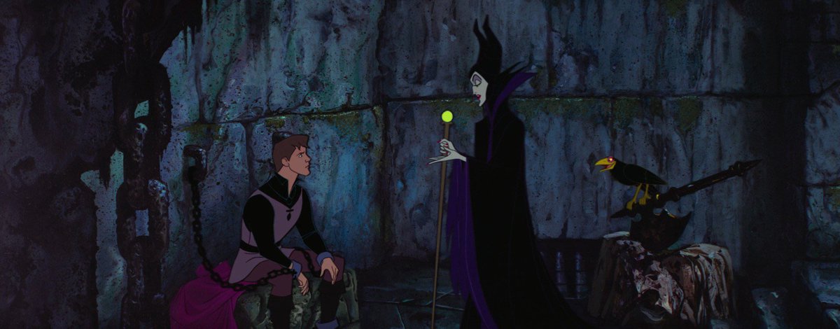 Odd_Audrey's tweet photo. If NRC housewardens are going to reenact iconic villain scenes with RSA, I wonder how it’d go with Malleus since Maleficent doesn’t have too many scenes of her opposing the good fairies outside of the curse, but then I remembered when she captured Phillip and taunted him 👀 https://t.co/oc2jwFNUfu