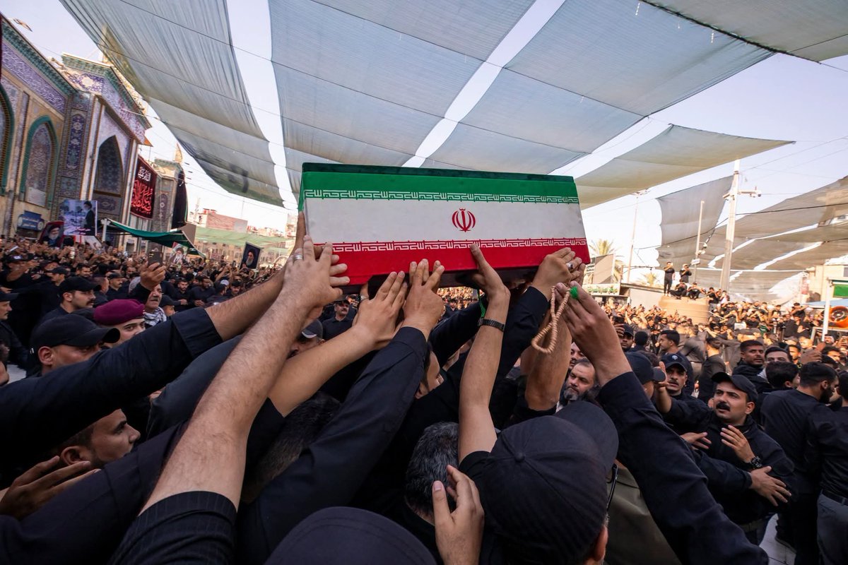 AdamARog's tweet photo. Mourners carry the coffins of family members of Iran’s late Supreme Leader Ayatollah Ali Khamene'i, inside the shrine of Imam Abbas during funeral ceremonies in Karbala, Iraq. #MartyrKhamenei https://t.co/AuT7viJHr1