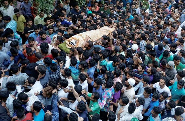 thecaravanindia's tweet photo. Archives | Burhan Wani, a 22-year-old man from Tral, joined the militant movement in Kashmir when he was 15 years old. He is perceived to be the face of new-age militancy in the region, and his emergence coincided with a fresh phase of insurgency in Kashmir.

Early in the morning, on 9 July, Burhan’s body was handed over to his family. People, numbering in tens of thousands, were waiting to catch a final glimpse of the man. The first funeral was held at around nine in the morning. As visitors from different parts of south Kashmir continued to visit Tral throughout the day, Burhan’s burial was delayed until afternoon.

By the time Burhan was buried, next to his brother Khalid Muzaffar Wani, at around 2 pm, nearly 22 prayers had been held for him—a first, in the history of any such funeral.

Read the news report from July 2016 by Qadri Inzamam and Haziq Qadri: https://t.co/XrSnr5eVA5
