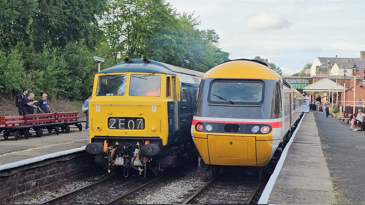 Harrod15S's tweet photo. D7076 & 43025 sit side by side at Bury Bolton Street Station on day 2 of the #ELR summer diesel gala 3/7/26 D7076 was heading back into the yard after finishing its workings for the day whilst 43025 had just arrived tnt with 43159 on the Heywood - Bury shuttle #class43 #class35 https://t.co/0Zf2I3Oi6g