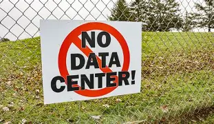 JungleBall_2's tweet photo. Data centers are a straight-up scam and a disaster for South Carolina, and this Lake Wylie project is Exhibit A in why York County needs to slam the brakes with that moratorium on July 13. 
These things are electricity vampires the size of small cities. They don’t just ‘use power’, they devour it at a rate that forces utilities to build new transmission lines, substations, and eventually new power plants, and guess who pays for every penny of that infrastructure? Regular homeowners and small businesses on Duke Energy and York Electric bills. 
The company can spin whatever fairy tale they want about ‘downward pressure on rates,’ but we’ve seen this movie in Virginia, Georgia, and Texas, the data centers get the cheap power and tax breaks, residents get the rate hikes and the blackouts when the grid can’t keep up.
Water? Lake Wylie isn’t some endless industrial reservoir. These facilities suck millions of gallons for evaporative cooling. During droughts (which we already deal with), actual residents and farmers get restricted while the data center’s landscaping gets the first cut?
They’re turning a recreational lake into their personal cooling tower.
And the jobs lie is the most insulting part. A few dozen high-paid tech roles that go to people imported from Charlotte or Raleigh, plus temporary construction crews. Meanwhile our neighborhoods get 24/7 fan noise, diesel backup generators belching fumes, traffic from construction, and once-pristine land turned into ugly industrial sprawl. 
Corporate welfare at its finest, they get incentives, we get the mess.
The fact this thing was fast-tracked before the legislature could finish protections against exactly this kind of rate-gouging and preferential treatment tells you everything. 
It’s classic bait-and-switch by politicians more interested in ribbon-cuttings than protecting the people who actually live here.
South Carolina doesn’t need to become another data center colony. Pass the moratorium, kill this project, and tell every other tech giant sniffing around that our power, our water, our air, and our quality of life are not for sale.