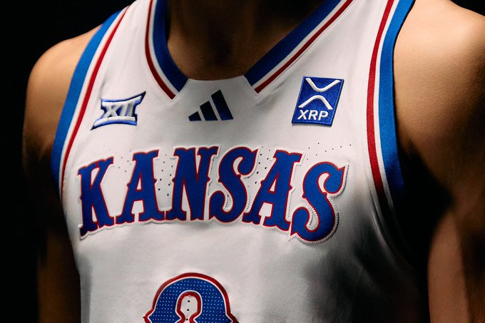 CoinDesk's tweet photo. NEW: $XRP becomes the first cryptocurrency to appear on the jersey of a major college athletics program.

@Ripple CEO @bgarlinghouse announces a partnership with his alma mater, the Kansas Jayhawks. https://t.co/fCBSyBy0sI