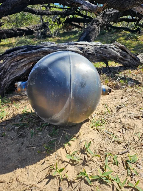 Kekius_Sage's tweet photo. The mysterious spheres that just washed up in Australia might actually be UFOs.

Finding six metallic spheres on a Queensland beach presents a massive anomaly. Authorities claim they are titanium pressure vessels designed to survive the extreme heat of atmospheric reentry.

But the crash dynamics make absolutely no sense.

Having six perfectly intact objects land in a tight cluster rather than scattering across a wide area is practically impossible for standard space debris.

Add the complete silence from the government about their exact origin, and an obvious question remains.

Are we looking at everyday space junk, or a massive smokescreen hiding advanced technology?