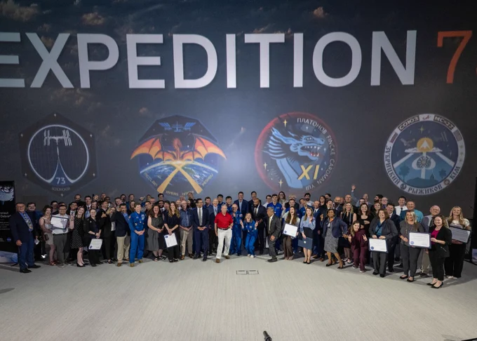 Awardees pose for a group photo from the Expedition 73 crew debrief and awards ceremony. Credit: NASA/Luna Posadas Nava