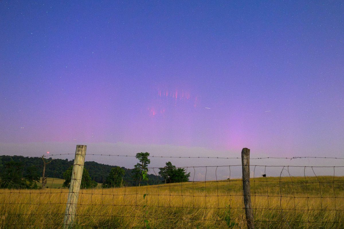 capitalweather's tweet photo. One of the weekend's more remarkable sky photos wasn't of the fireworks. 

This image captured both the northern lights and the rare glow of thunderstorm sprites near Winchester early Saturday morning. 

Here's the story behind this extraordinary pairing:  https://t.co/7u8AYdLQoW 

Photo by Nathan Sottung