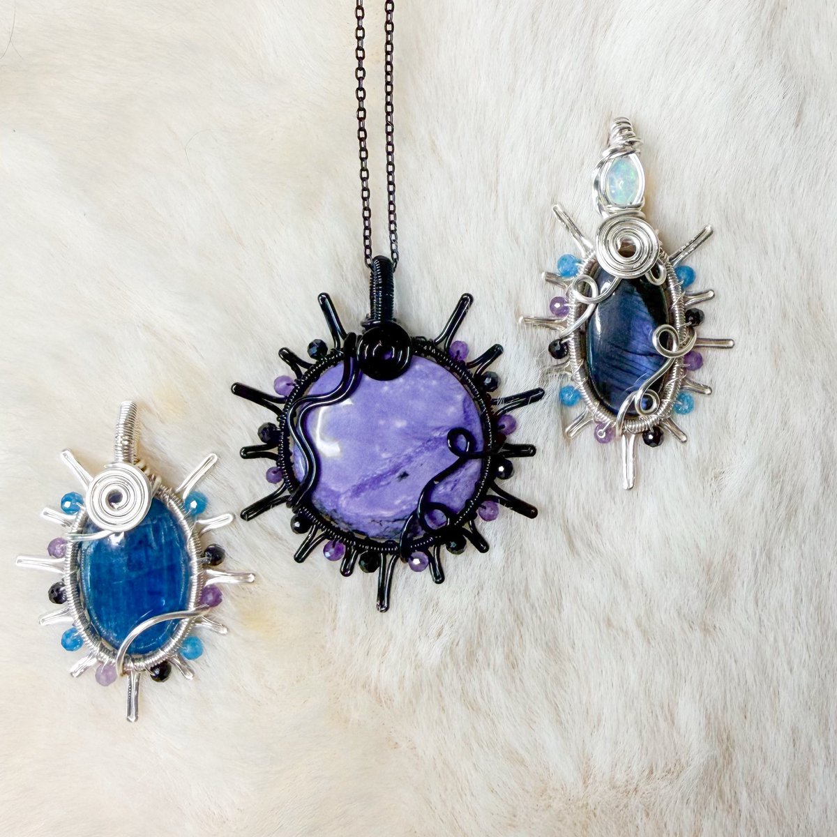 mildhippie's tweet photo. 3 pendants just went up on my shop 👀🖤💜💙 since yesterdays sold out so fast!! Here’s an apatite x tourmaline beaded sun, Charoite x tourmaline beaded sun, and another opal x lab x tourmaline beaded sun! https://t.co/5FxyZ8zWJT