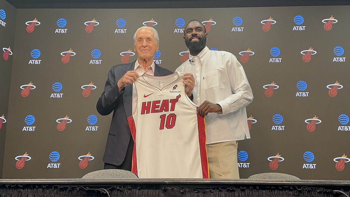 ZachWeinberger's tweet photo. Pat Riley coming out with Tim Hardaway Jr., presenting him the No. 10.

“Thought we hung this up?” Riley said. #Heat https://t.co/GGkR3MN45F
