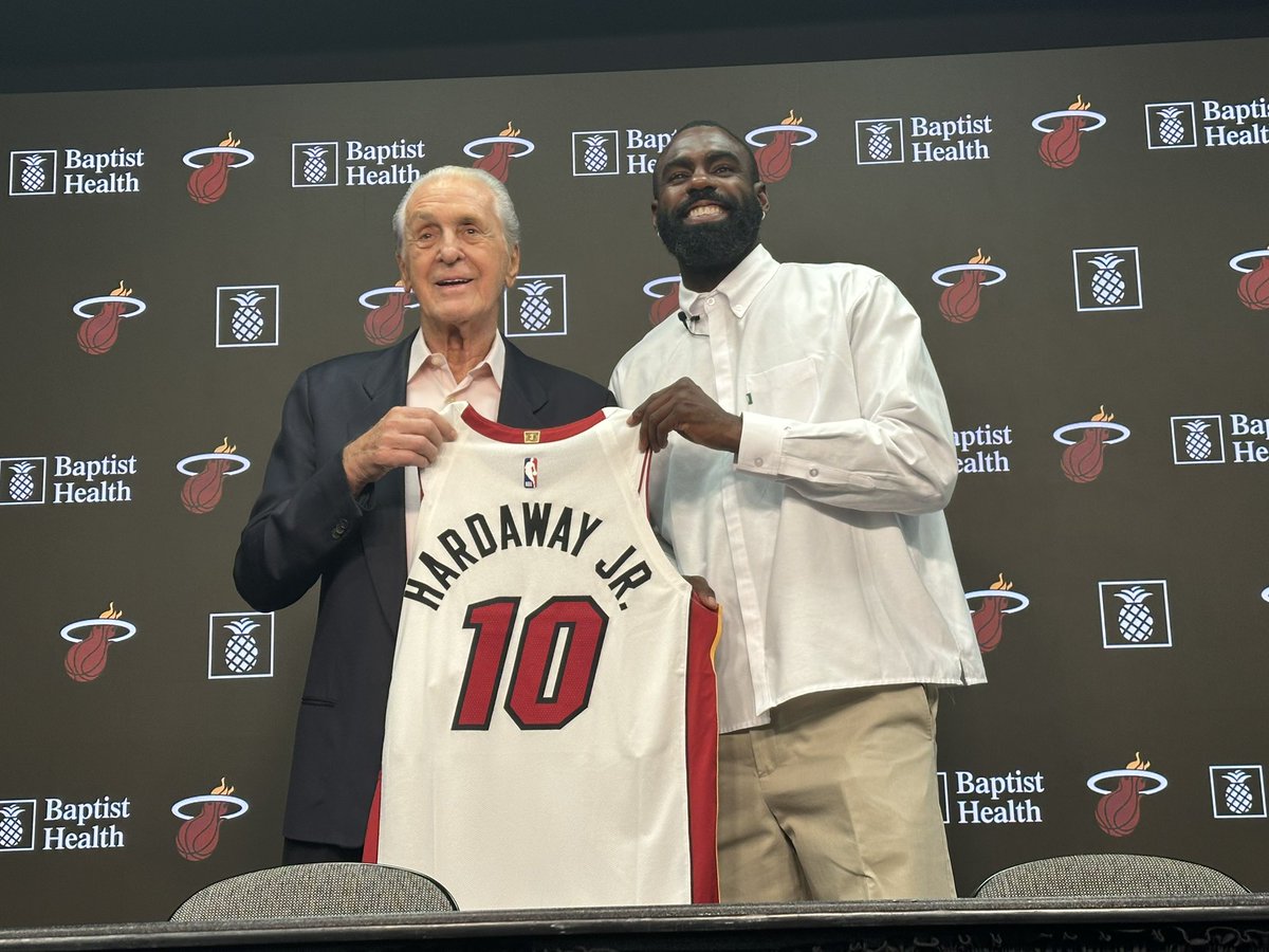 ZachWeinberger's tweet photo. Pat Riley coming out with Tim Hardaway Jr., presenting him the No. 10.

“Thought we hung this up?” Riley said. #Heat https://t.co/GGkR3MN45F