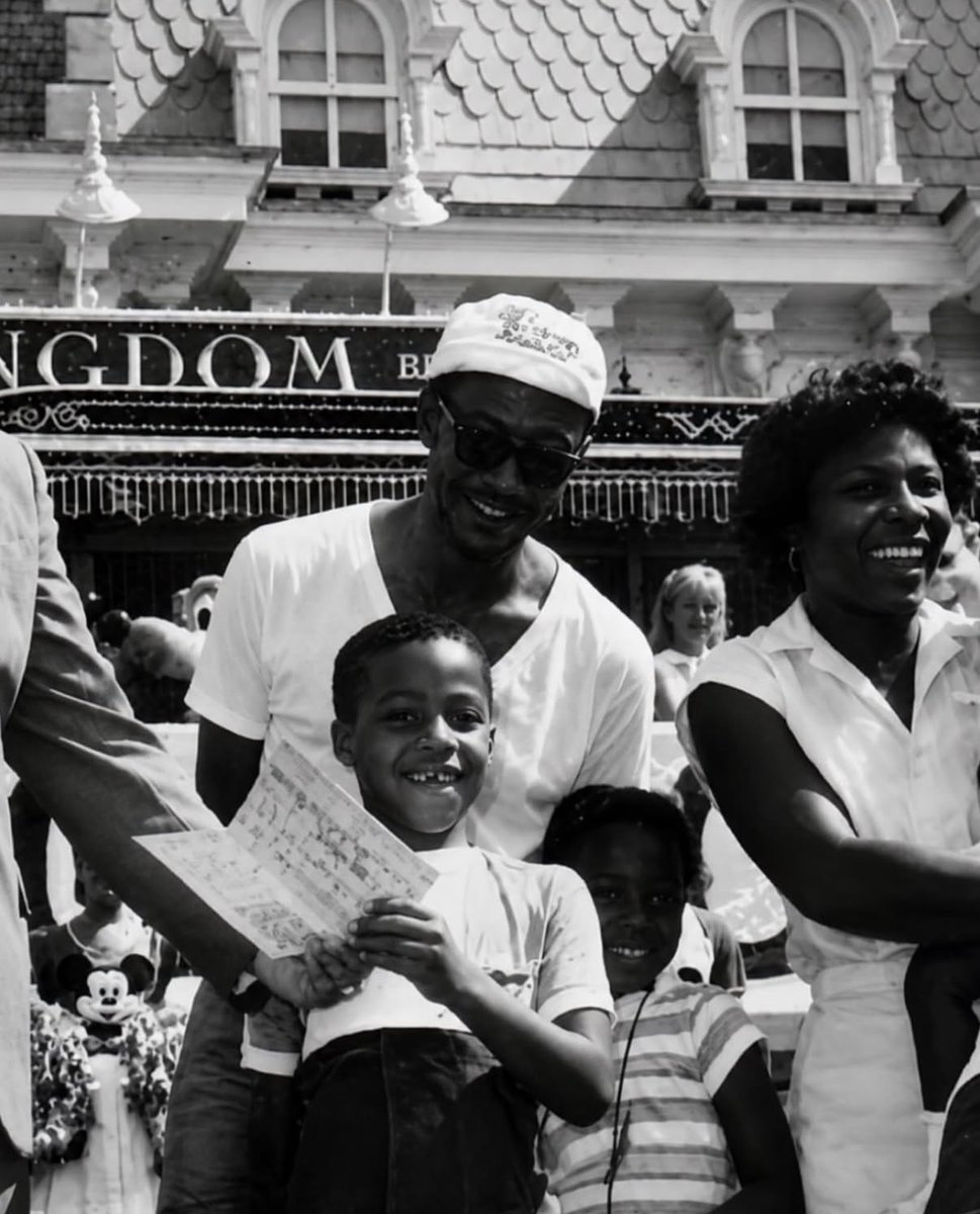 historyinmemes's tweet photo. A 7-year-old boy became Disney World’s 200 millionth guest and was awarded free admission for life. Nearly 40 years later, he is still taking advantage of the prize, visiting the parks with his wife and children.

In July 1985, seven-year-old Virgil Waytes Jr. of Miami unknowingly became Walt Disney World’s 200 millionth guest as he passed through the entrance gates during his family’s first visit to the park.

Disney marked the milestone with live music, fireworks, and a special ceremony that left the young boy completely surprised. As part of the celebration, he received one of the company’s rarest rewards: a lifetime pass granting free admission to Disney theme parks around the world.

Nearly four decades later, Waytes still makes regular use of the extraordinary pass. It has no blackout dates and allows him to bring up to three guests on each visit. Now living in North Carolina, he often takes his wife and children to the parks, saying the greatest reward has been creating lasting family memories without the high cost of admission. Disney continues to honor the lifetime pass, and on some visits it has even covered food and merchandise purchases.