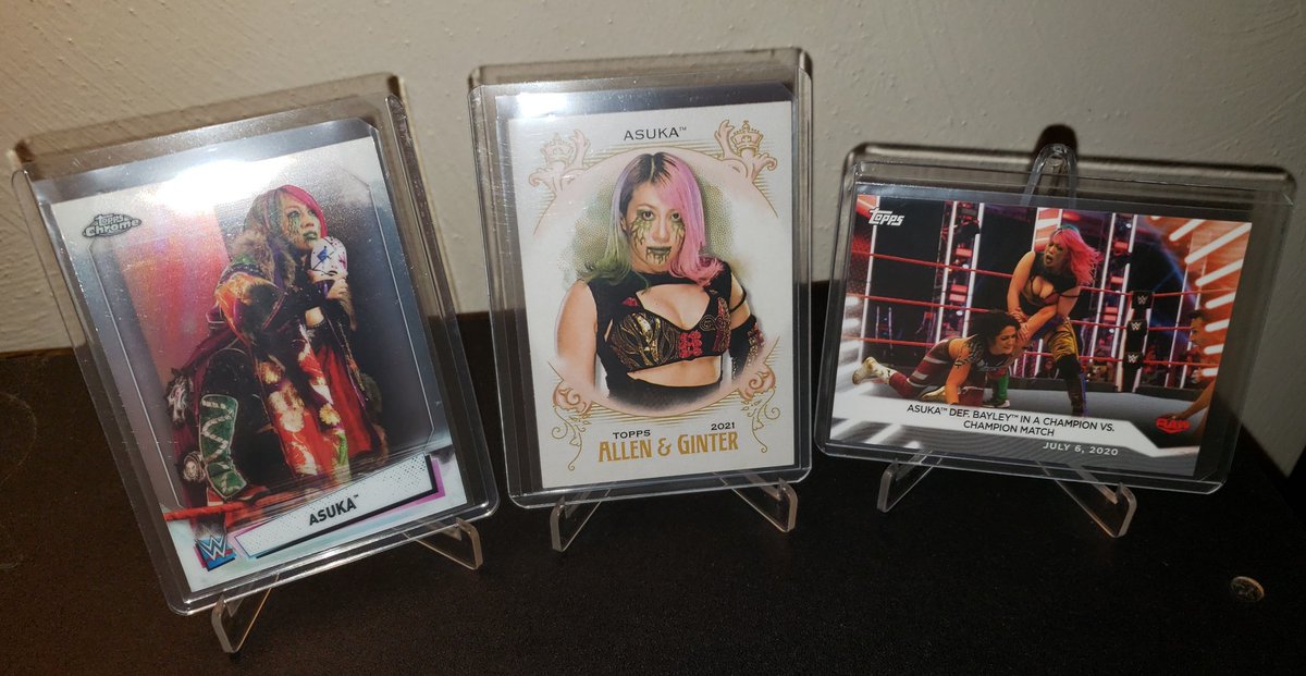 SWF_YouTube's tweet photo. It's #wrestlingcardwednesday and all of these cards are from 2021 Topps sets:

- Chrome WWE Asuka #7
- Heritage WWE Asuka AG-3
- Women's Division WWE #39

#wrestlingtradingcards
#wrestlingcards https://t.co/MHxPTURSta