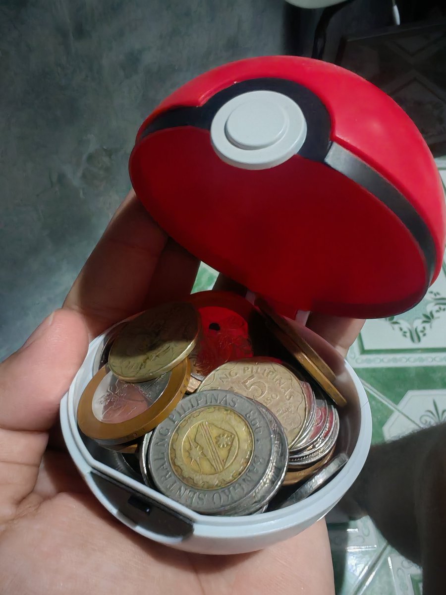 Trongel7090's tweet photo. Im using the Jollibee pokemon ball toy as a coin purse https://t.co/DdQE3MhQKg
