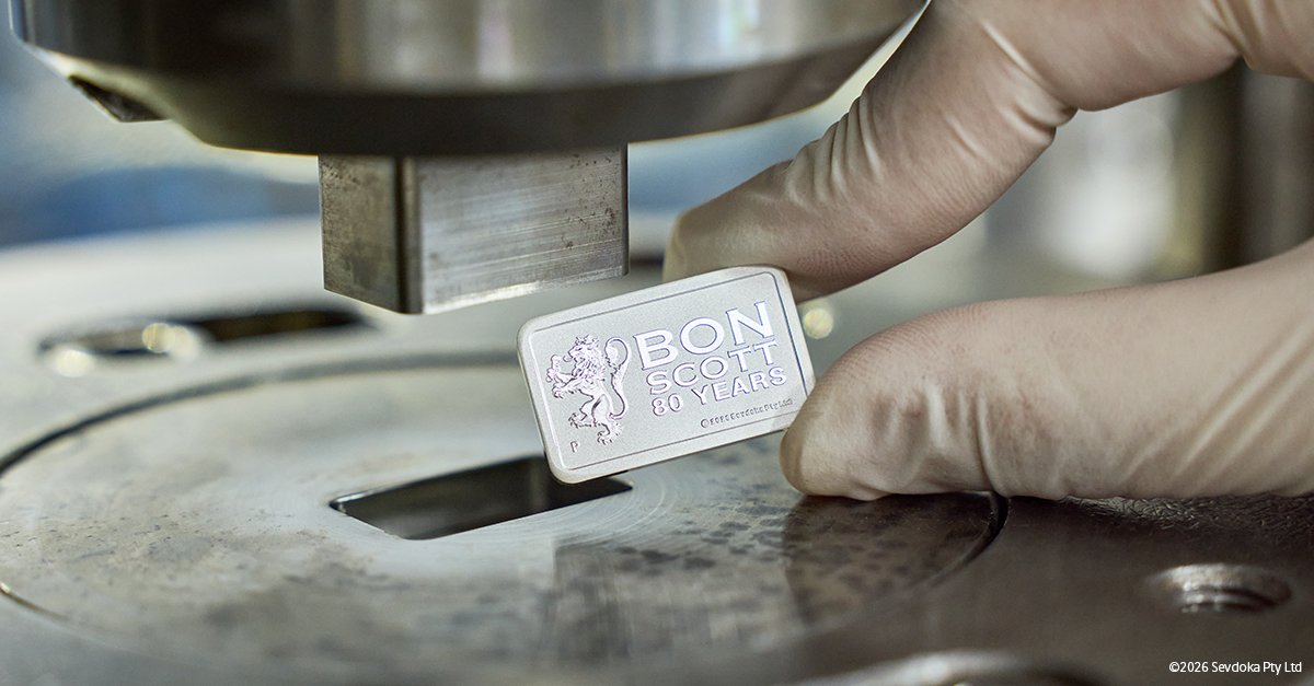 perthmint's tweet photo. 🦁 Eighty years on from his birth, Bon Scott remains one of Australia's most influential musical icons.

To commemorate his enduring legacy, we're proud to release the Bon Scott 80th Anniversary 2026 1g Gold and 10g Silver Minted Bars | https://t.co/PNZgoncrns

#ThePerthMint https://t.co/Ou9knokmDr