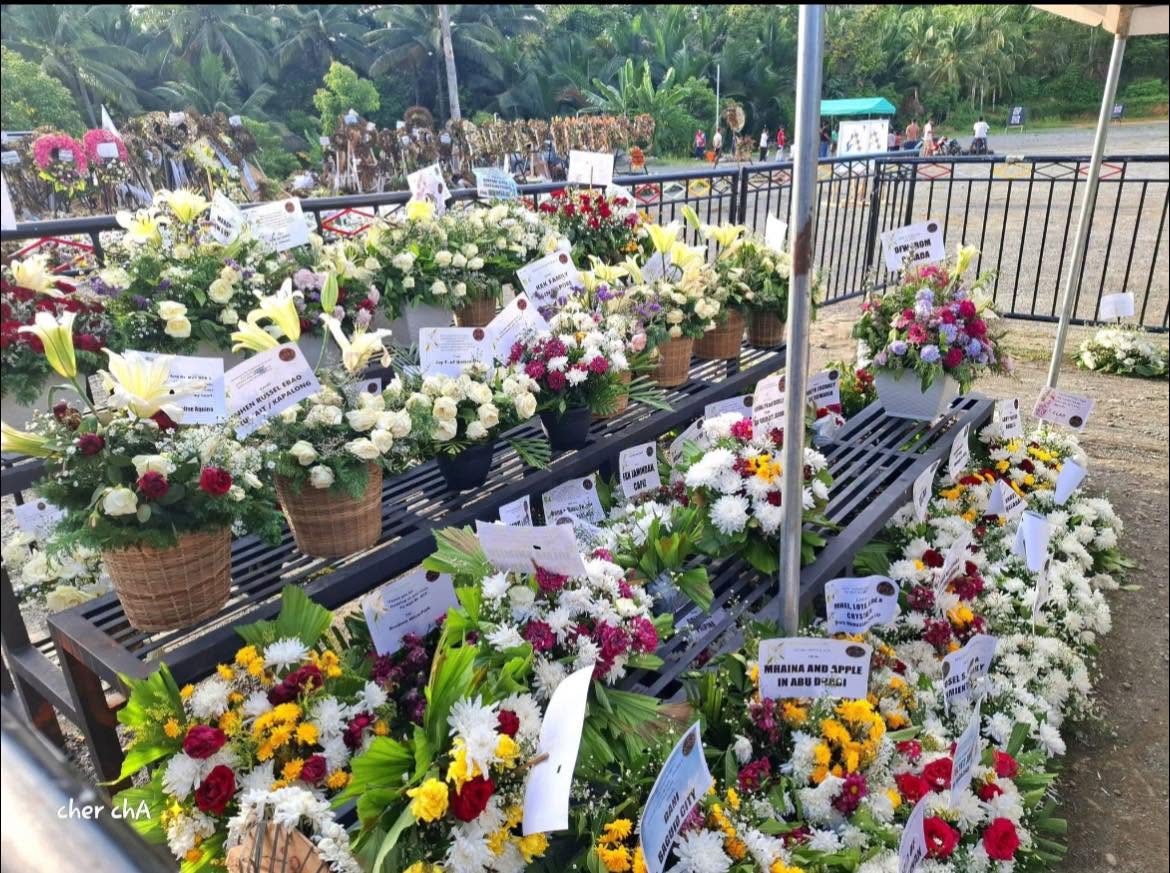 ABSCBNNews's tweet photo. LOOK: Student-athlete Rene Baterbonia's tomb was filled with flowers as people remembered him a month after his death.

Baterbonia and teammate Divine Adili drowned during an Ateneo Blue Eagles "team-building" in Dipaculao, Aurora. | via @HernelTocmo 

Read: https://t.co/MeleN2gAti