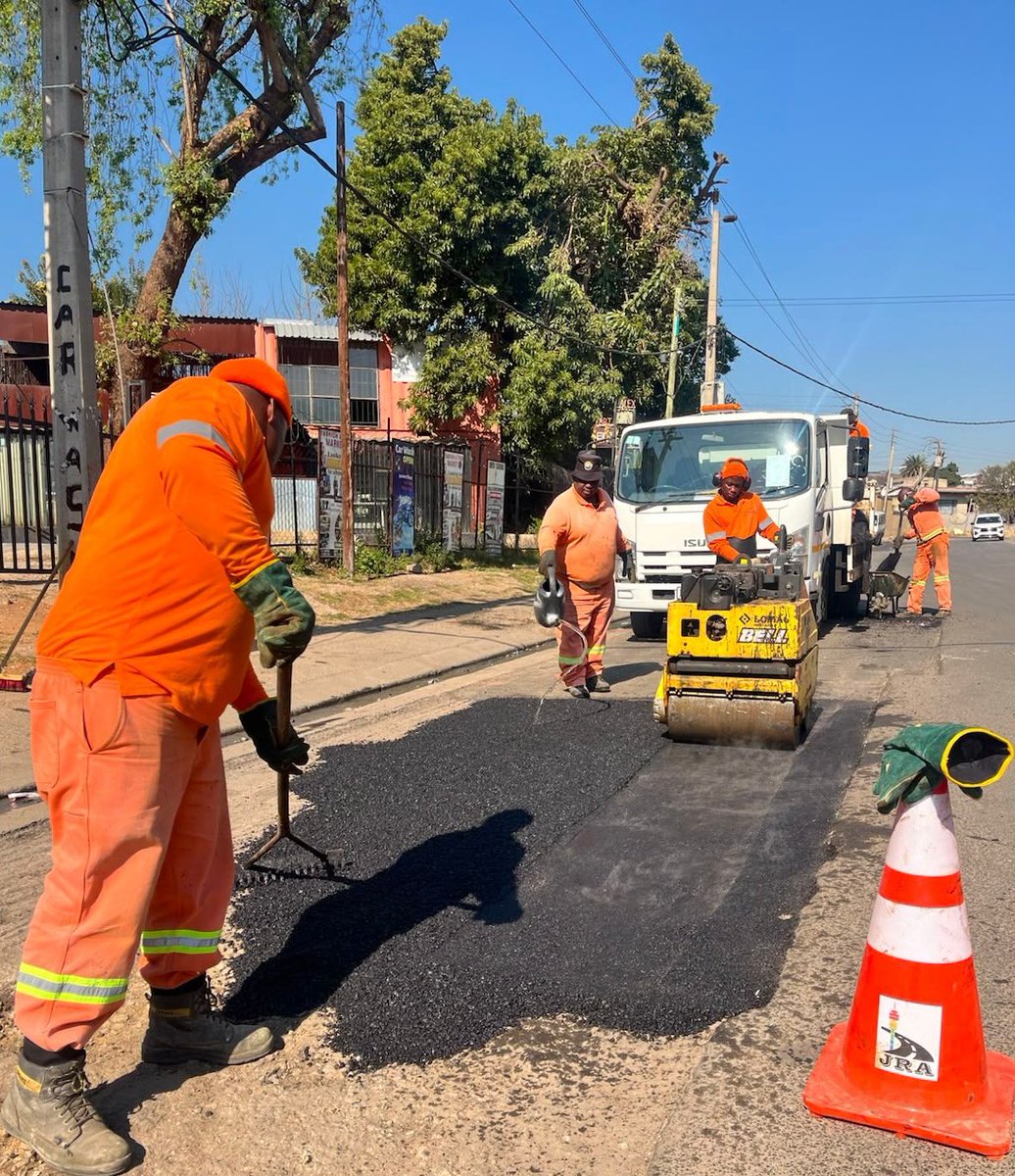 MyJRA's tweet photo. Road patching works on Josias Madzunya Street in Alexandra, Region E, to restore the road surface and improve traffic flow 🚧 @CityofJoburgZA @CoJ_RegionE https://t.co/rFYPTWAmio