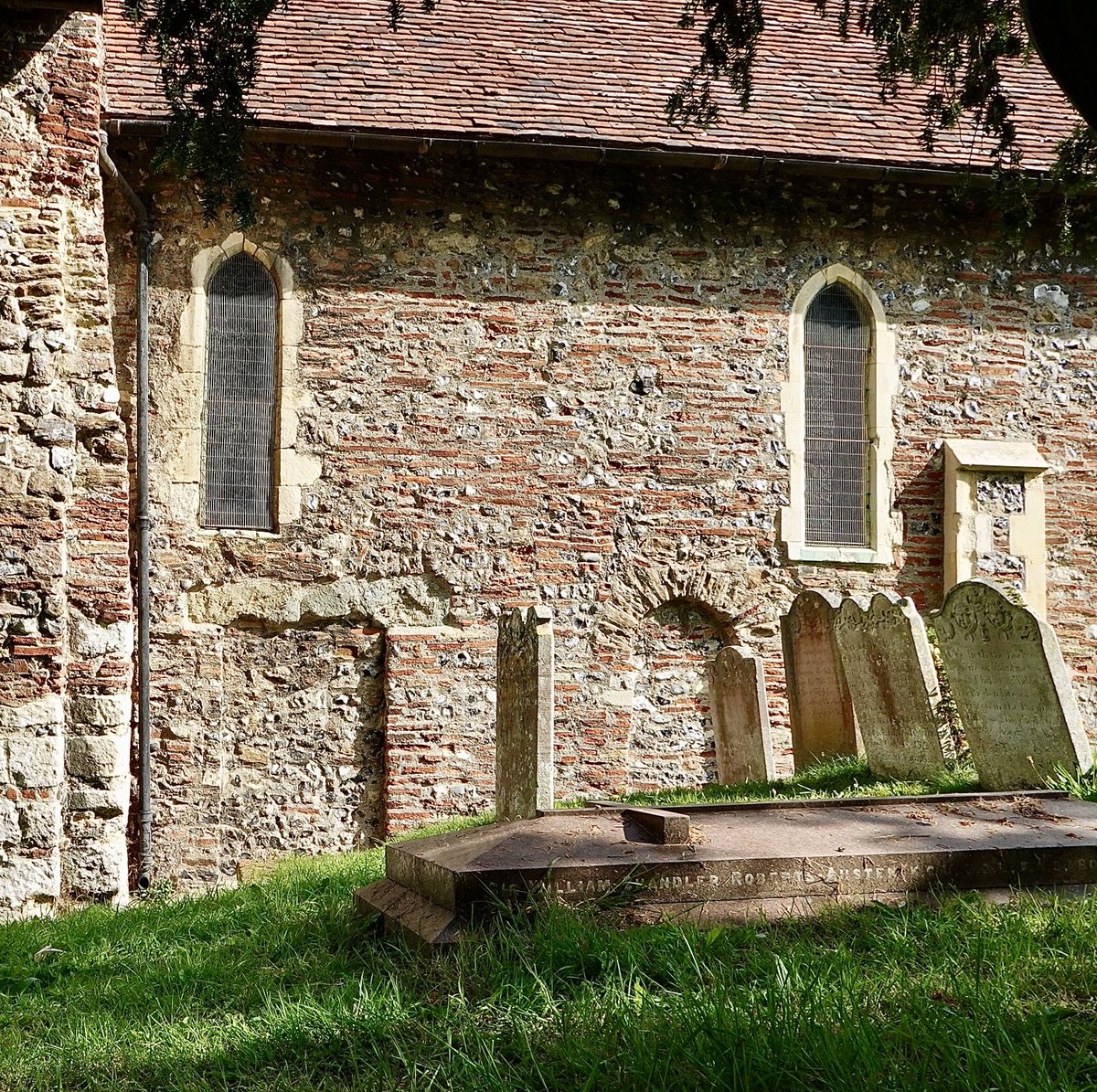 CalSmithBooks's tweet photo. Two for the price of one—not ornate, both blocked up, but ancient! Square one on left is 7th century, probably the private entrance of Queen Bertha of Kent to her chapel. Note the repurposed Roman bricks. 

St Martin’s, Canterbury (oldest church in England) #ADoorableThursday https://t.co/z6TZazLnW2