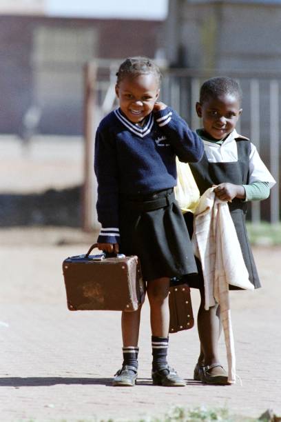HistorySAZAR's tweet photo. Children smile dressed in their school uniforms, on June 4, 1987, in the historic township of Sharpeville. Credit: Trevor Samson/AFP https://t.co/czPWL5rI5P