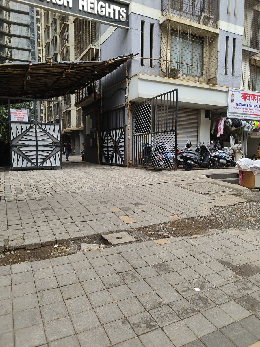 shaileshydv's tweet photo. @mybmcWardRS @mahanagargas @Yogeshsagar09 This is photo of our footpath outside society: Kalpavruksh Heights, Lalji Padha, Kandivali W. Mahanagar Gas has dig this footpath to lay down line for backside SRA building but left it without proper repair from last 1 month. Take action. https://t.co/BxESDWXP7V
