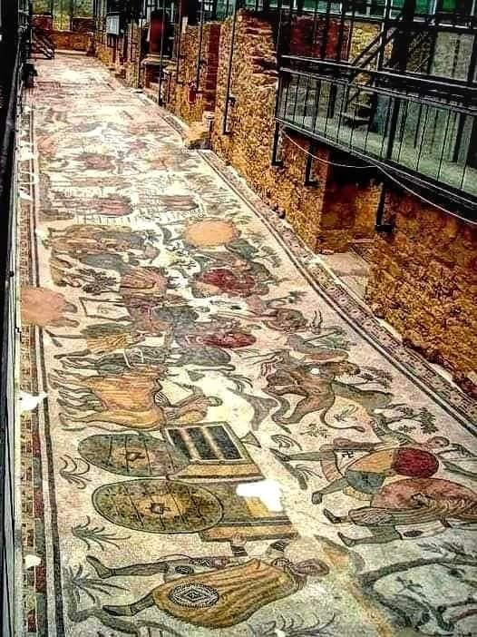 CultureExploreX's tweet photo. The Great Hunt Mosaic in Sicily leaves you standing inside an empire that wanted to be seen as master of everything it touched.

Spread across the Villa Romana del Casale near Piazza Armerina, this vast 4th-century mosaic shows hunters, ships, carts, and exotic animals being captured and transported from across the empire, from North Africa to the eastern Mediterranean. 

It is one of the clearest visual records of Roman power, wealth, trade, and spectacle, because it shows how far Rome could reach and what it wanted to display at home. 

Even the floor became a statement: we command the land, we command the sea, and we can bring the whole world into our house.