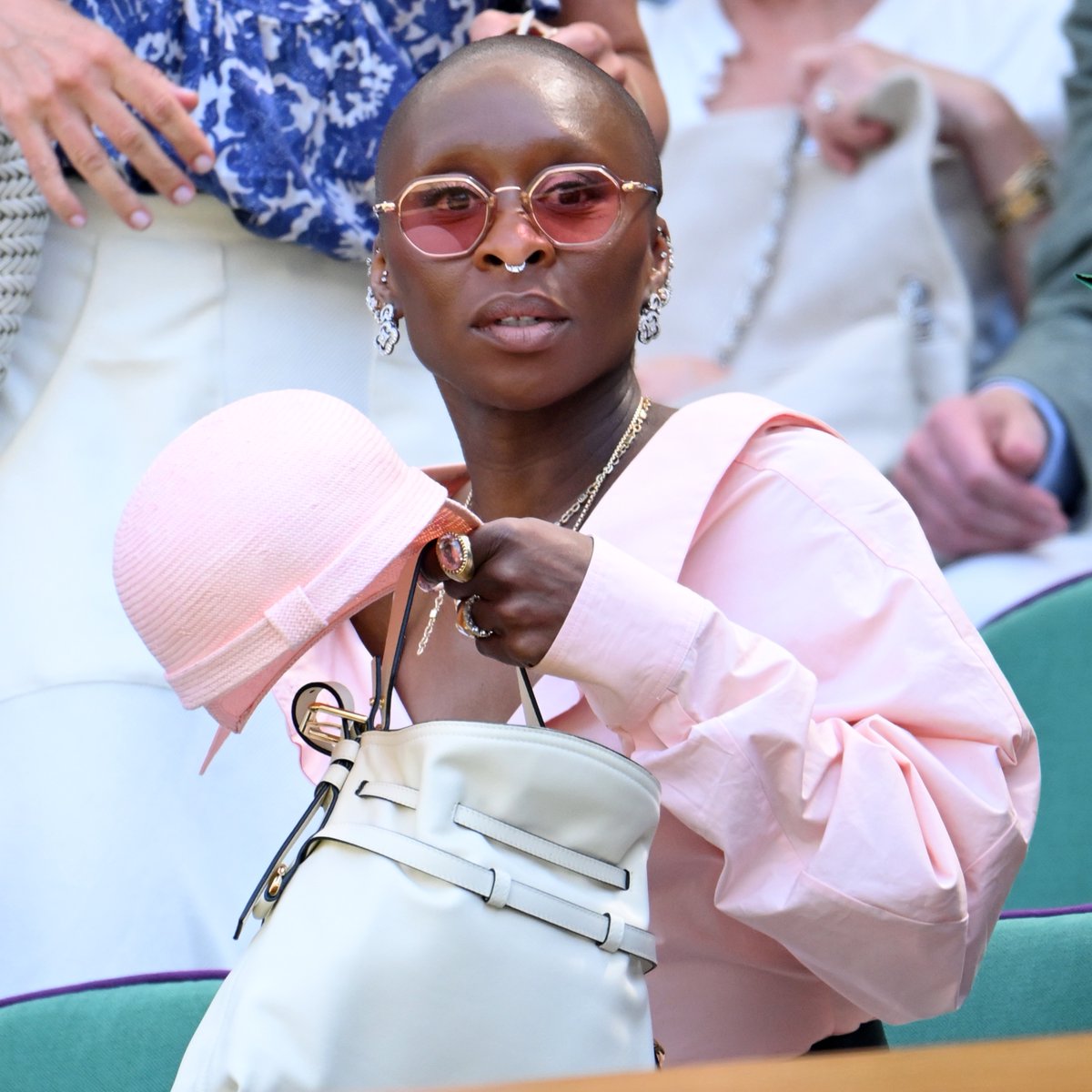 WTA's tweet photo. Pink goes good with 🌱

Cynthia Erivo in the crowd today at @Wimbledon ! 

#Wimbledon https://t.co/5hLPdu6MHE
