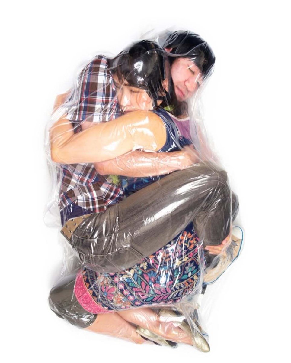 rogue's tweet photo. Photographer Hal's "Flesh Love" series where he literally vacuum-seals real couples to show the ultimate form of human intimacy https://t.co/Aebw5Hf05v