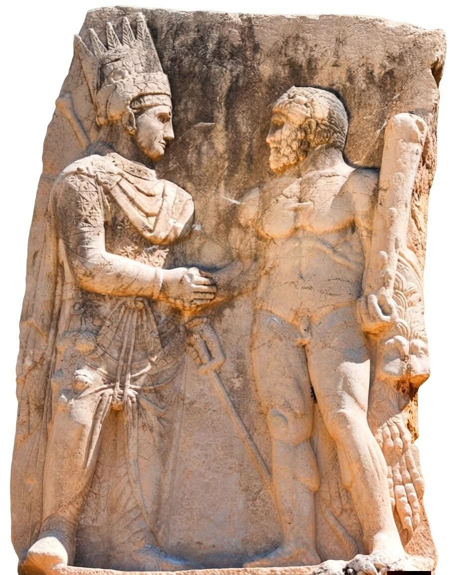 histories_arch's tweet photo. The ancient site of Arsameia, located on the Nymphaios river (modern Eski Kâhta) in Adıyaman province of southeastern Türkiye 🇹🇷, features a relief depicting King Mithridates I Kallinikos of Commagene (or his son, King Antiochus I) shaking hands with the Greek god Heracles. 

This handshake, known as dexiosis, symbolizes unity, diplomatic alliance, and equality between the mortal king and the divine. By carving this scene, the Commagenian kings aimed to legitimize their rule, asserting that their royal lineage and authority received divine approval.

The monument is a stunning blend of Hellenistic Greek and ancient Persian artistic traditions, with King Mithridates depicted wearing elaborate Persian royal attire and a pointed Armenian tiara, while Heracles is shown in the classical Greek style, muscular and draped in a lion's skin with his iconic club. 

A rock carving of Persian King Mithridates shaking hands with Greek God Heracles. 

#archaeohistories