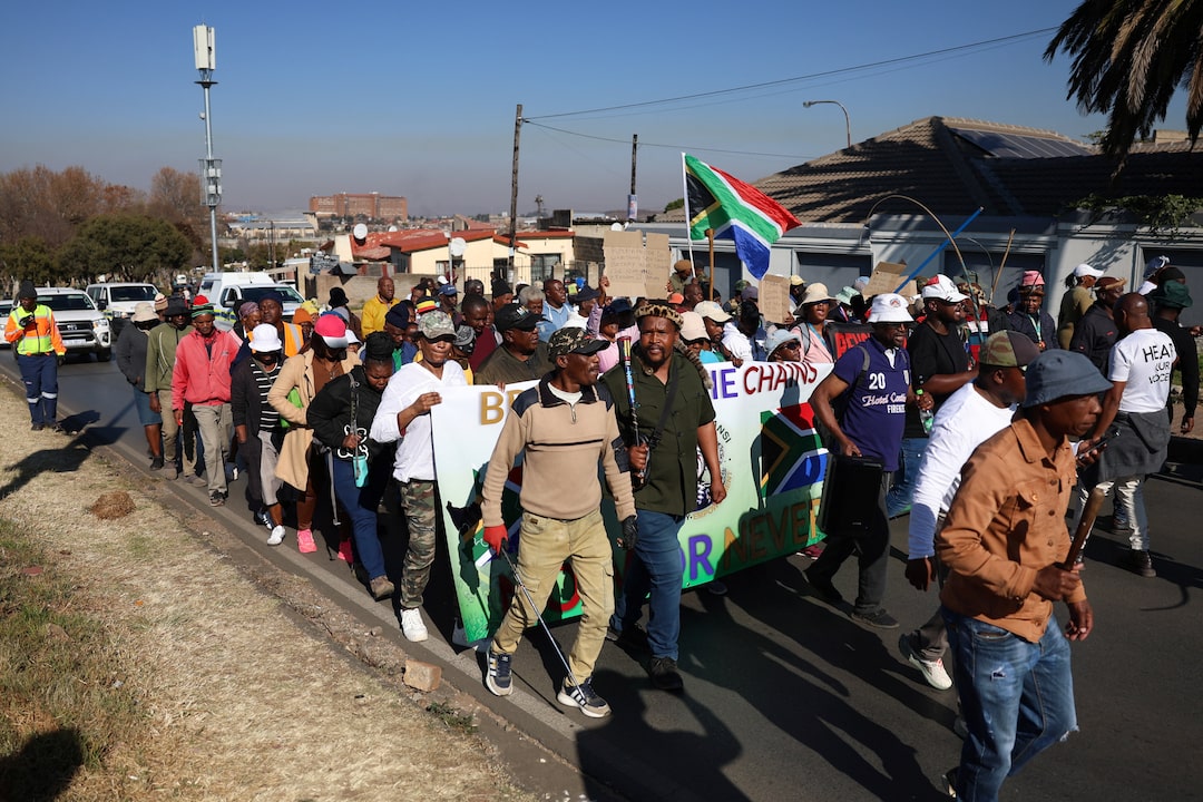 thepunch223's tweet photo. South African protesters go door-to-door forcing immigrants from their homes

JOHANNESBURG, July 9 (Reuters) - Groups of anti-immigration South Africans seized foreigners from their homes in Johannesburg on Thursday ​and handed them to police in a hardening of protests that have sown fear ‌in communities and strained ties with some countries.
In Johannesburg's Alexandra township, a Reuters reporter saw protesters breaking down doors and entering houses where they believed undocumented immigrants were hiding.

They escorted the people to police vans where they were taken away, including a ​woman and a small child from Malawi. Another man who was apprehended by the marchers told ​Reuters he was in the country legally.
"I am a ZEP holder," said the ⁠Zimbabwean national, Total Mhlanga, referring to the Zimbabwean Exemption Permit which allows tens of thousands of nationals ​to live and work in South Africa.

In Soweto, anti-immigrant protesters marched through town wielding sticks and flags, with ​plans to go search for undocumented immigrants. Several of the flyers for Thursday's protests advertised a "peaceful march" followed by "door to door". Another march took place in Durban on the east coast.
South Africa, where millions of people are unemployed, has seen a ​surge in anti-immigrant sentiment in recent months, culminating in nationwide protests on June 30, an informal deadline set ​for undocumented immigrants to leave the country.

The most prominent leader of the movement, former radio presenter Jacinta Ngobese-Zuma, said on ‌that day ⁠that protests would take place every Thursday until demands were met.
Her group, March and March, has painted undocumented immigrants as the source of South Africa's economic problems and is demanding tighter border controls, mass deportation, and for schools and health centres to serve South Africans first.

We are walking around doing door to door ​removing foreigners," said a community ​leader, Bongani Msomi, at ⁠the march in Alexandra.
President Cyril Ramaphosa has warned against scapegoating immigrants for deep-rooted problems, and his government has repeatedly told citizens that they do not have the ​right to take immigration enforcement upon themselves.
Police have stepped up arrests of undocumented ​migrants in ⁠response to the protests, and have also deployed officers during recent marches for safety. A spokesperson for Johannesburg police was not immediately available for comment on the actions of the protesters or the officers at the scene.

Malawi's government ⁠said ​on Thursday that over 38,000 of its citizens had returned from ​South Africa in recent weeks, as part of a massive repatriation effort due to safety concerns. Over 60,000 have also returned to ​neighbouring Zimbabwe.