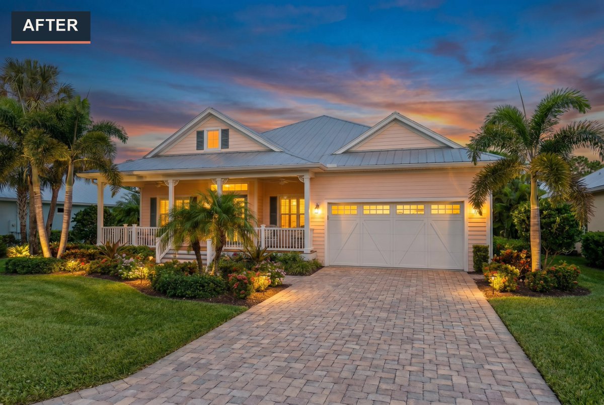 Staging_Studio's tweet photo. Midday blue swapped for a pink-and-amber sunset sky - and the warm glow spilling through the porch windows and garage panels makes this cottage feel alive. Landscape lighting now draws the eye right up the paver drive. #RealEstatePhotography #RealEstateMarketing https://t.co/hl8PcjXiW1