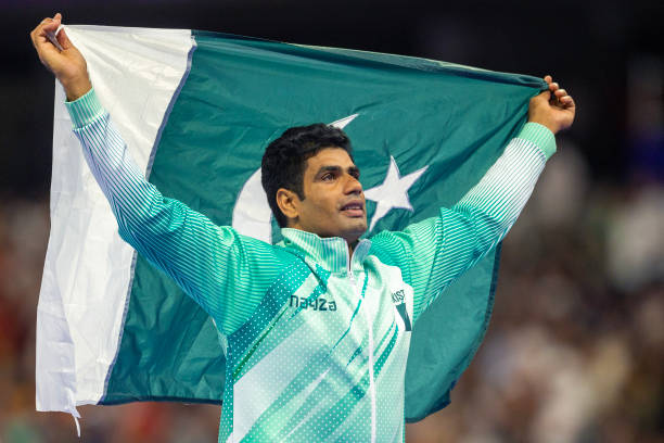 faizanlakhani's tweet photo. Olympic champion Arshad Nadeem will carry Pakistan's flag at the opening ceremony of the 2026 Commonwealth Games in Glasgow on July 23. The Pakistan contingent, led by Chef de Mission Maj Gen Adil Rehmani, will also feature Islamic Solidarity Games bronze medallist Fatima Zahra as the King's Baton bearer.