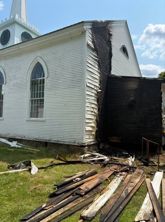 TheMaineWire's tweet photo. The Maine State Fire Marshal’s Office determined on Tuesday that a mysterious fire at a Dennysville church was intentionally set.

The fire took place at the Dennysville Edmunds Congregational Church, at 17 King Street on Monday morning.

Due to a quick response from the Dennysville Fire Department, the blaze was quickly extinguished and caused only exterior damage.

The fire took place while no one was inside the church and sparked an investigation by fire marshals.

They determined that the fire started outside near the rear of the church, and further investigation led them to determine that the fire was intentionally set.

Marshals are now requesting the public’s assistance and asking anyone with information to come forward.

Marshals have not publicly identified a suspect.