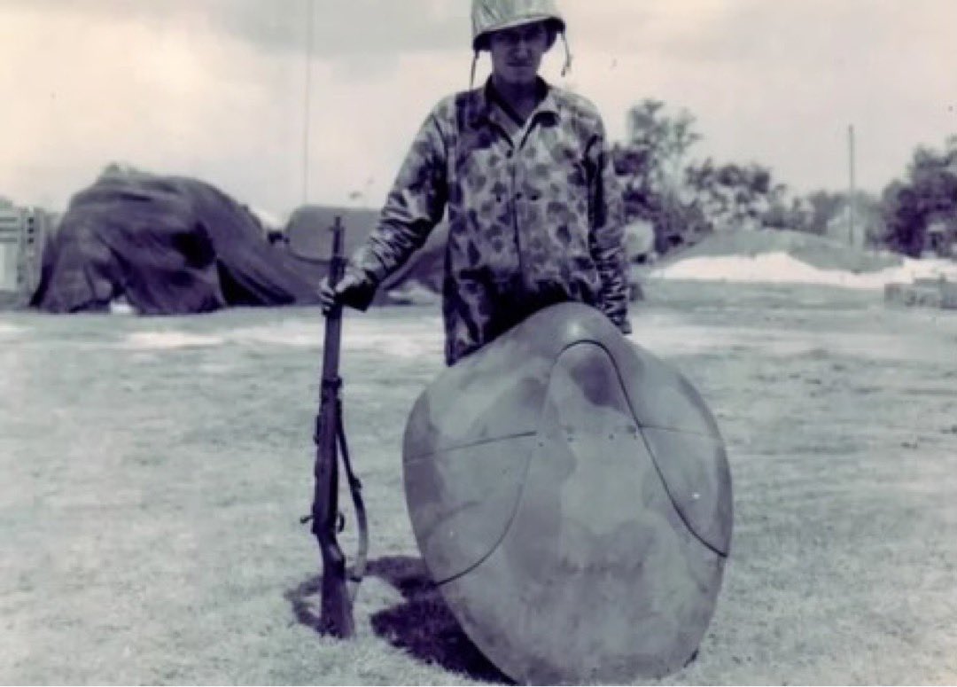 blackstarops's tweet photo. an american marine shows how a captured japanese turtle shield armour works with a japanese rifle (1944) https://t.co/gqR9qcqA8Z