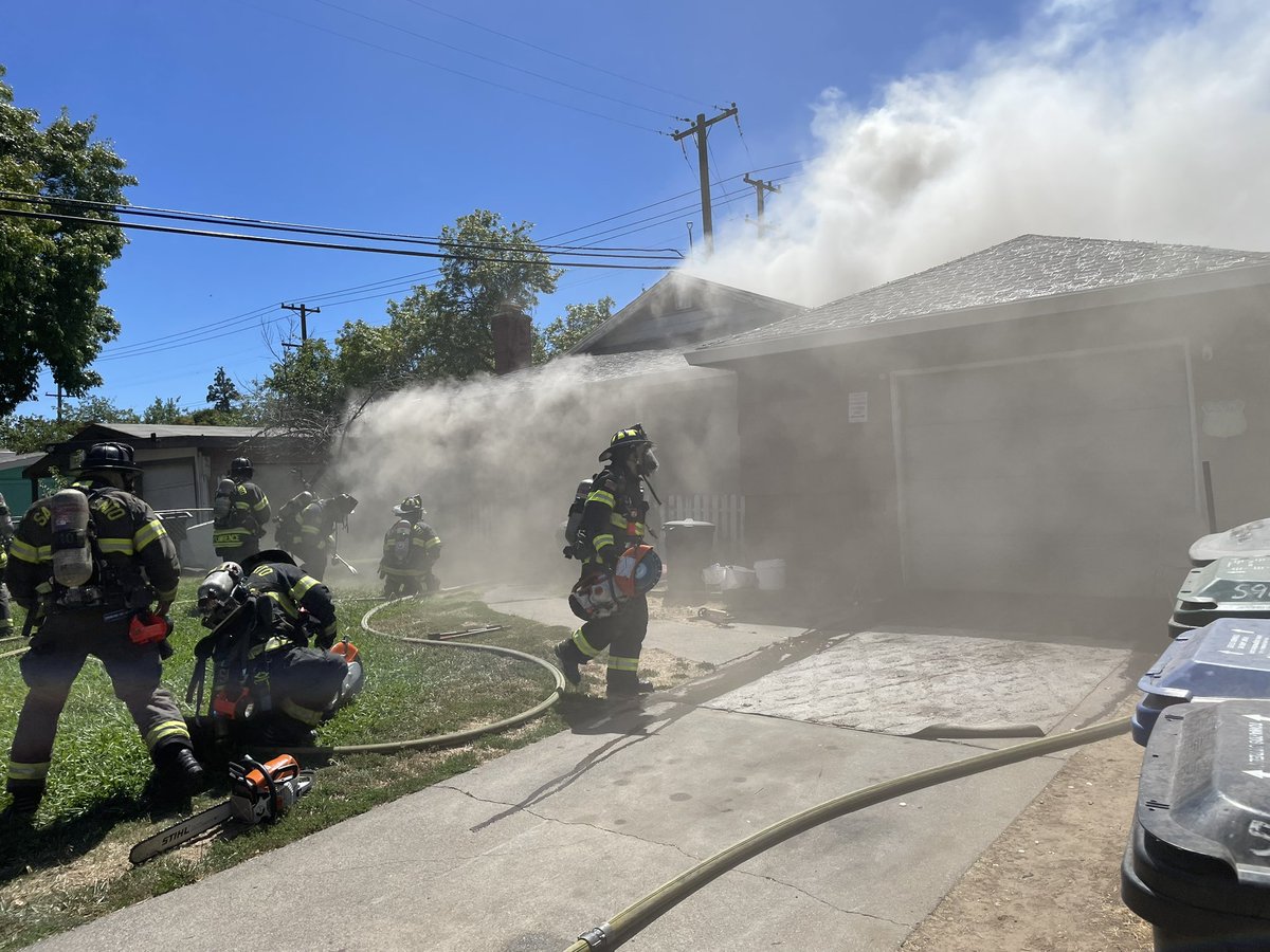 SacFirePIO's tweet photo. Structure Fire:

5900 block of 41st St. 

Crews arrived to heavy smoke pushing out of the garage and front door with fire on the backside of the house extending into the attic. Occupants escaped safely and the cause is under investigation. https://t.co/iYEt4180VI