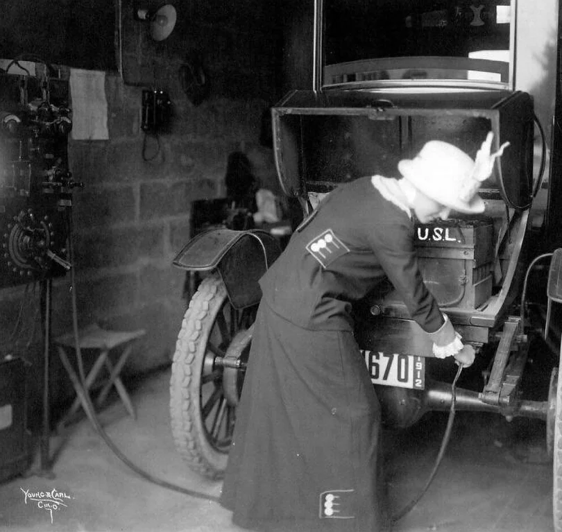 Rainmaker1973's tweet photo. A 1912 shot of a woman plugging in her electric car.

During the early twentieth century, electric vehicles were highly popular in urban areas due to their quiet operation and clean emissions. These early cars were especially favored by women because they did not require the dangerous and physically demanding hand-cranking needed to start gasoline engines.