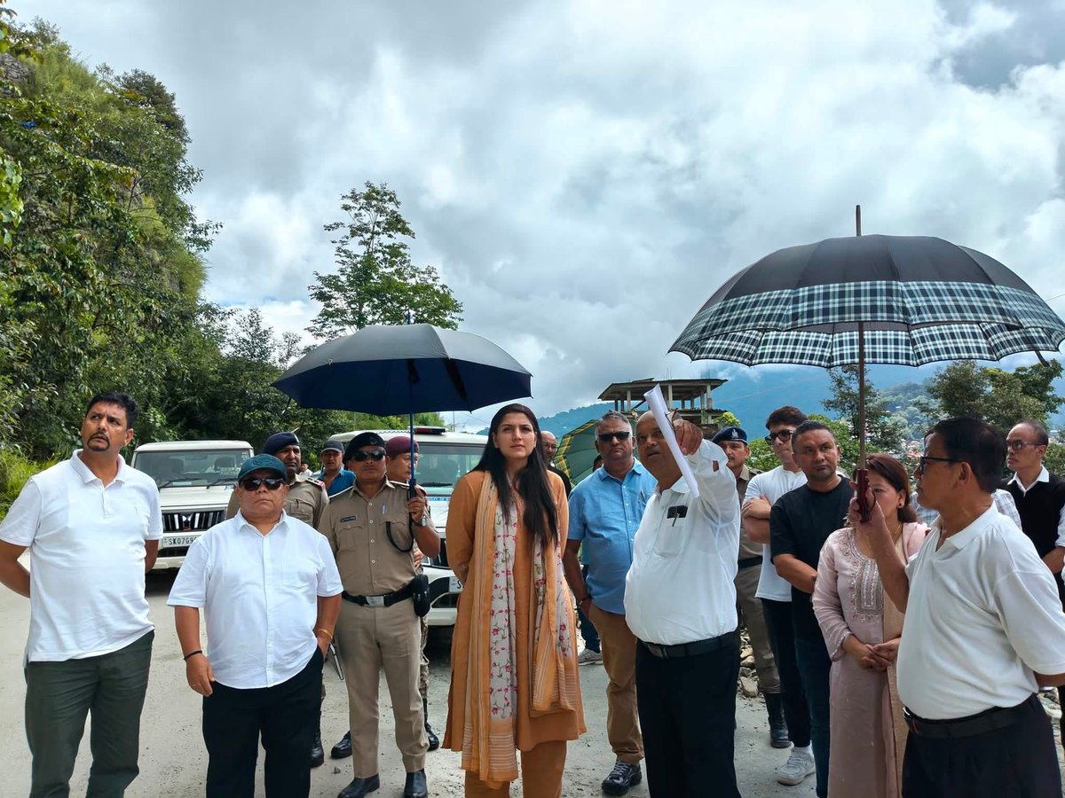 paribishnoidc's tweet photo. District Collector inspects landslide site and drainage issues near Bhanu Turning…

An inspection team led by the District Collector, Pakyong, Mrs. Pari Bishnoi, conducted a site inspection of the landslide-affected area and drainage-related concerns at multiple locations near Bhanu Turning, Pakyong, today.

During the inspection, the team was briefed on the blockage of hillside water flowing through culverts due to debris accumulation, which resulted in the overflow of water onto the road and adjoining private properties, causing further damage to the affected area.

DC Pakyong, Mrs. Pari Bishnoi reviewed the condition of the affected slope, retaining structures, and surrounding areas. She enquired about the cause of the slope failure, the extent of damage, water supply issues, existing drainage arrangements, emergency mitigation measures, and the ongoing response being undertaken by the concerned agencies..