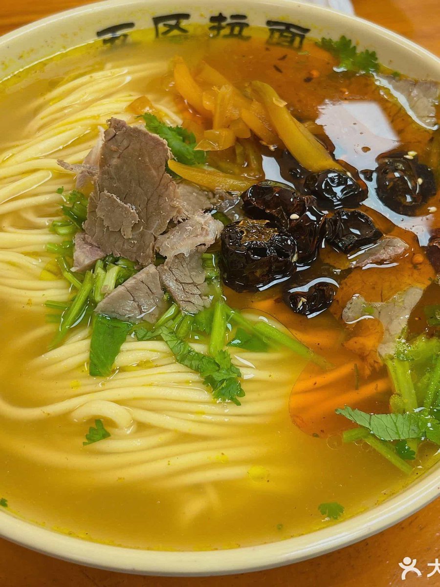PameliaHipqs's tweet photo. Late night comfort: a bowl of hot ramen with soft-boiled egg on the counter, warm lamp glowing outside the tiny stall. https://t.co/glOP3vgO6V