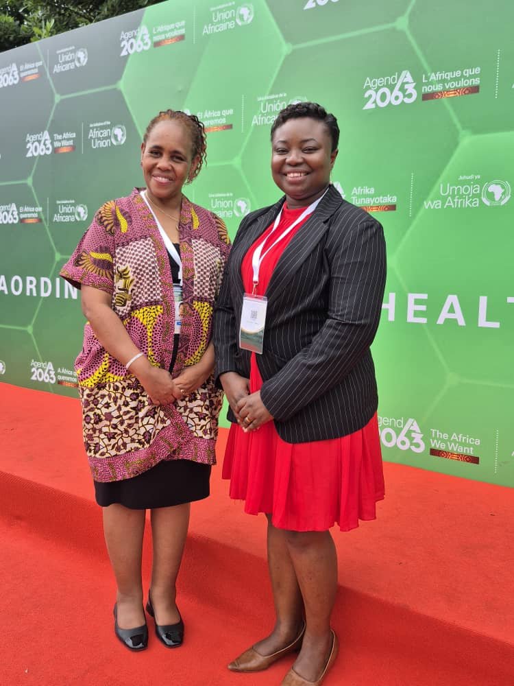 IOMatAU's tweet photo. IOM's @awakimani & Dr. Mawusi Ama Kemetse attended AU #AfHealthSummit in Accra, where Member States committed to turning declarations into action for sustainable health financing. IOM supports AU's vision for Universal Health Coverage, ensuring health systems reach mobile pops. https://t.co/zx88knoAKo