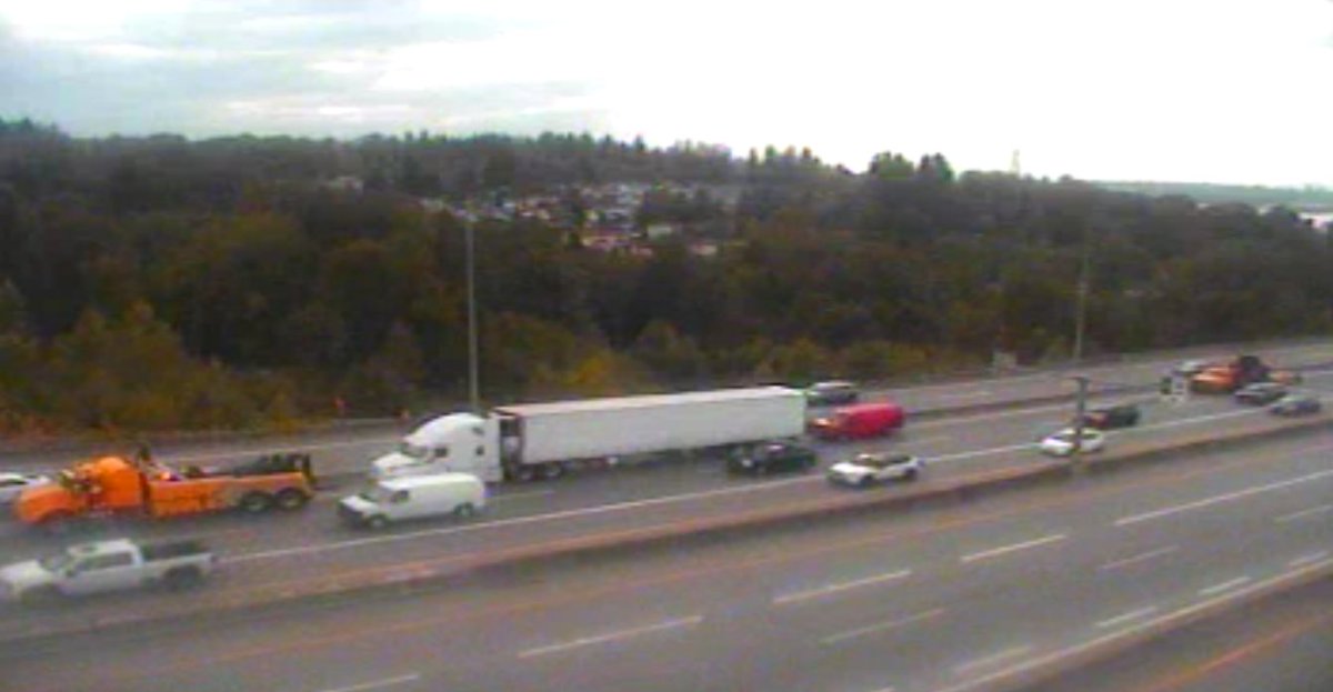DriveBC's tweet photo. ⚠️#BCHwy1 - eastbound tractor trailer issue at the east end of the #PortMann Bridge, and is blocking lane 3 of the through lanes. #SurreyBC #SlowDownMoveOver #SDMO🦺 @BCHwyPatrol https://t.co/5aINzp6F0j