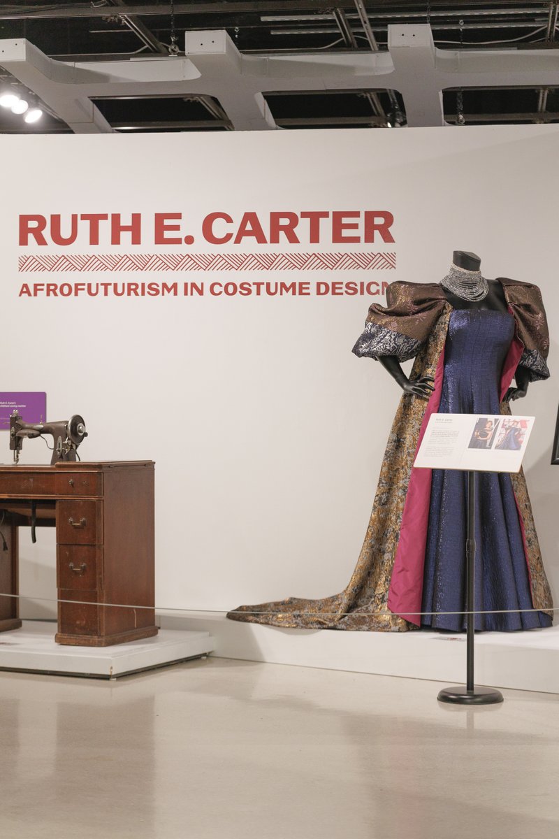 aampmuseum's tweet photo. What's more iconic that designing your own Oscars dress? Ruth E. Carter designed and wore this gown for the 2019 Oscars where she won her first Academy Award for costume design. Get your tickets to "Ruth E. Carter: Afrofuturism in Costume Design" now: https://t.co/06FUMylVdA https://t.co/OnwYkjaI5J