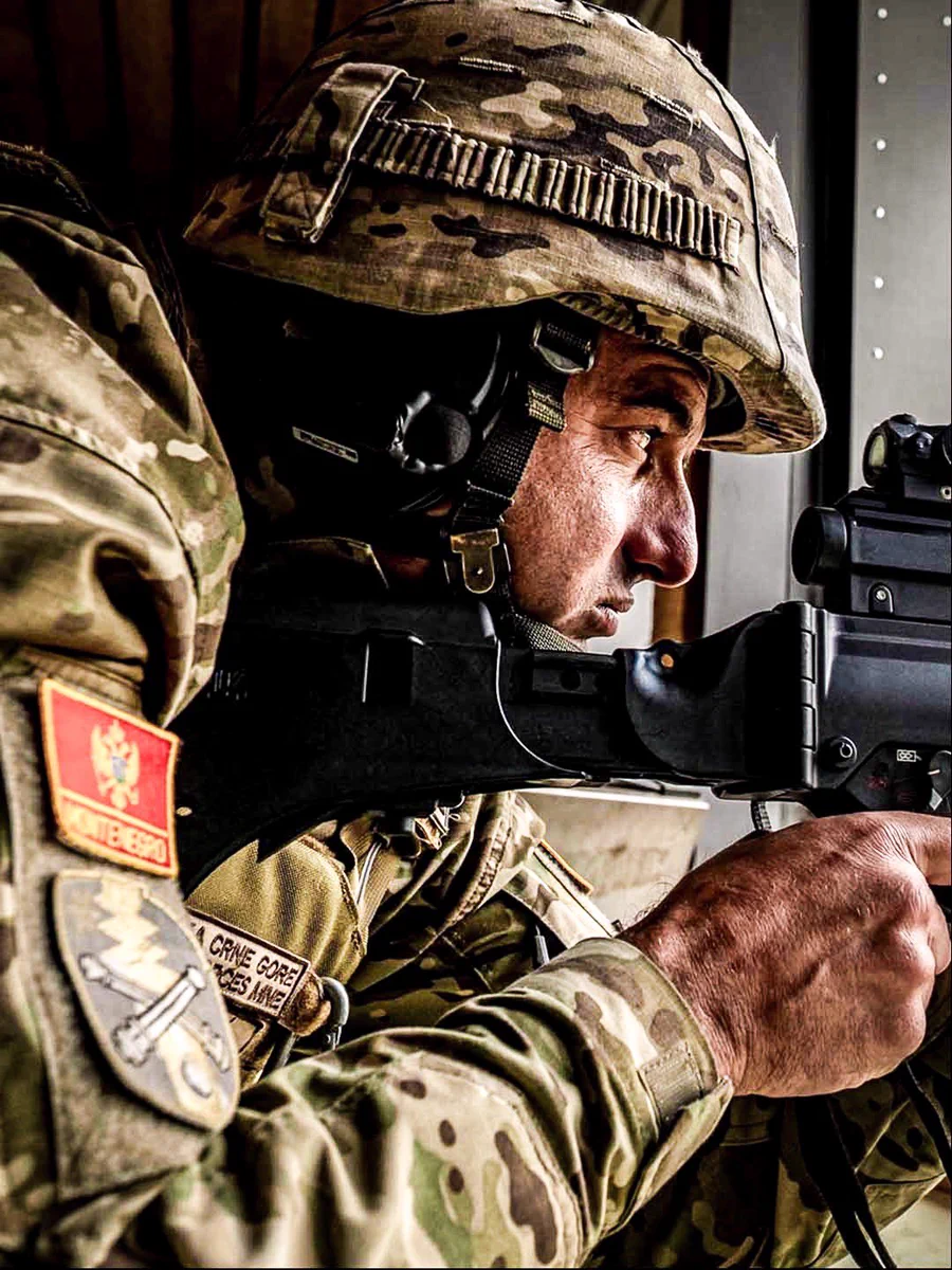 A Montenegrin soldier aiming a rifle. Photo by Captain Joffray Provencher and Corporal Lynette Ai Dang, eFP BG Latvia Public Affairs and Imagery Section.
